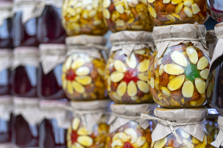 Multicolored fruit and berry jam in glass jars.の写真素材