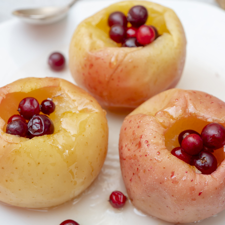Baked apples with berries.の写真素材