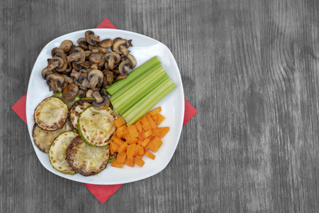 Vegan diet food. Fried mushrooms with celery, carrots and zucchini.の写真素材