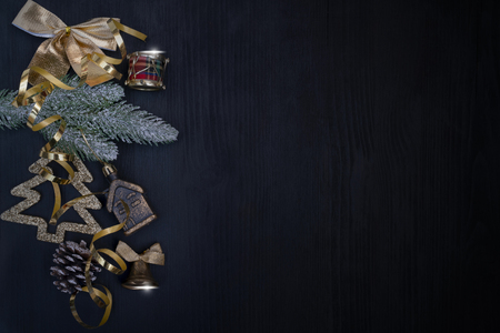 Golden Christmas toys on a black background.の写真素材