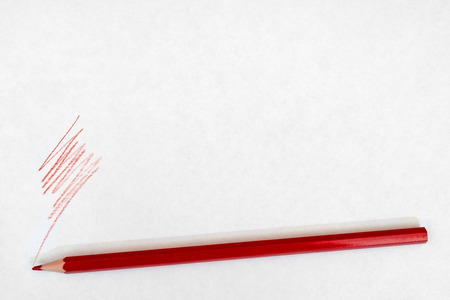 red pencil writes on white paper.の写真素材