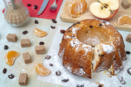 Fresh baked delicious homemade cake with tangerines, raisins. Holiday for the whole family.の写真素材