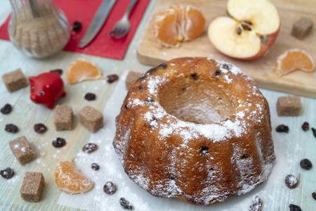 Fresh baked delicious homemade cake with tangerines, raisins. Holiday for the whole family.の写真素材
