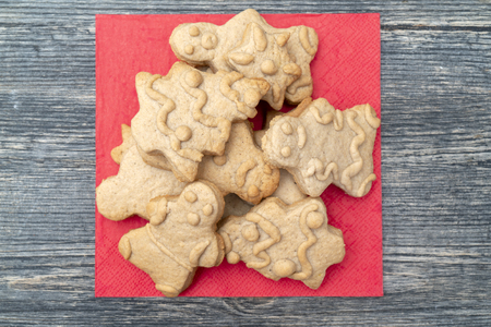 Gingerbread Cookies Christmas figures from dough, baked in the oven. On baking paper. The concept of Christmas meals.の写真素材