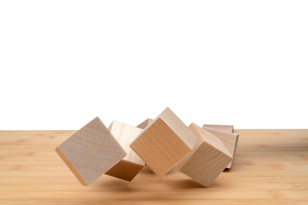 Wooden cubes roll on an inclined plane.の写真素材