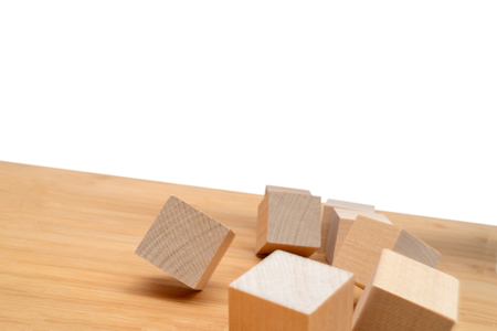 Wooden cubes roll on an inclined plane.の写真素材