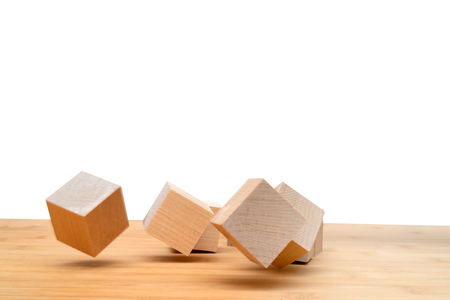 Wooden cubes roll on an inclined plane.の写真素材