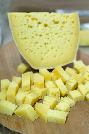 cheese is cut into small cubes.の写真素材