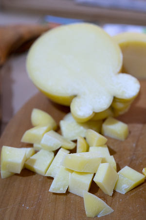 cheese is cut into small cubes.の写真素材
