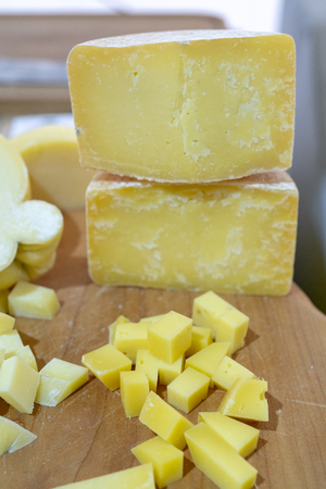 cheese is cut into small cubes.の写真素材