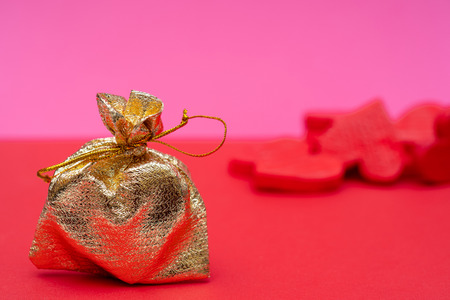 heart in a gold bag is a gift for Valentine's Dayの写真素材