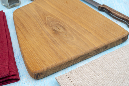 Wooden oak cutting board. Kitchenware. Copy space.の写真素材