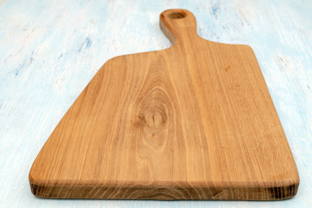 Wooden oak cutting board. Kitchenware. Copy space.の写真素材