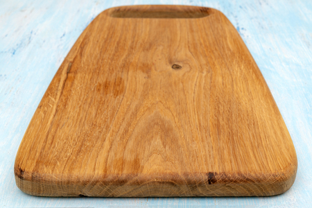 Wooden oak cutting board. Kitchenware. Copy space.の写真素材