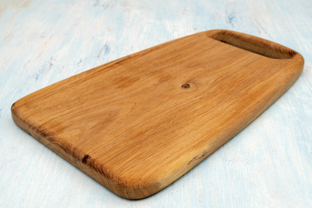 Wooden oak cutting board. Kitchenware. Copy space.の写真素材