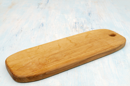 Wooden oak cutting board. Kitchenware. Copy space.の写真素材