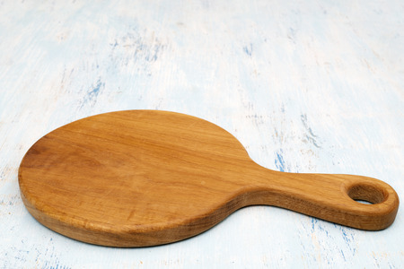 Wooden oak cutting board. Kitchenware. Copy space.の写真素材