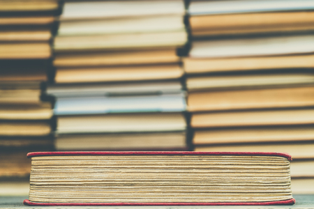 Old book in the red obnozhka. Symbol of knowledge and learning.の写真素材