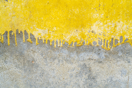Texture of old plaster. Yellow and gray paint.の写真素材