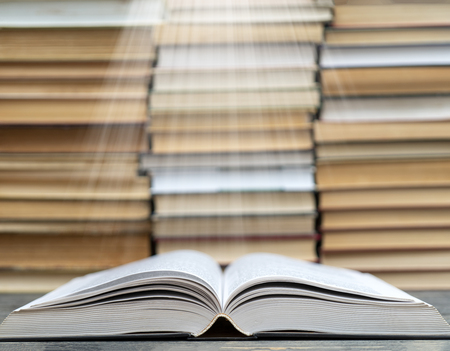 Book pages emit light. Symbol of wisdom, knowledge and learning.の写真素材