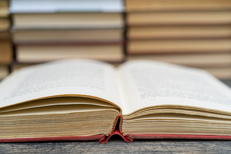 Old book in the red obnozhka. Symbol of knowledge and learning.の写真素材
