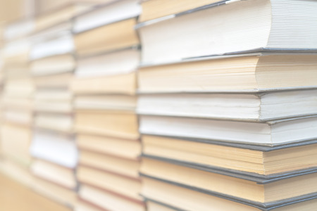 Rows of books in the library. Background for text. Symbol of knowledge and learning.の写真素材