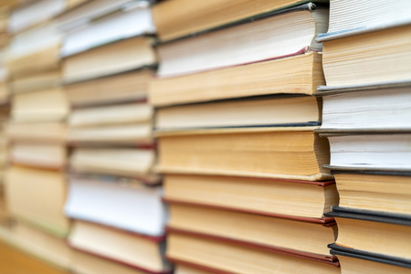 Rows of books in the library. Background for text. Symbol of knowledge and learning.の写真素材