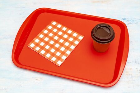 Red plastic dining tray on the table.の写真素材