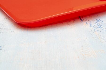 Red plastic dining tray on the table.の写真素材