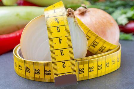 Measuring tape for measuring the circumference. Vegetables for diet cooking.の写真素材