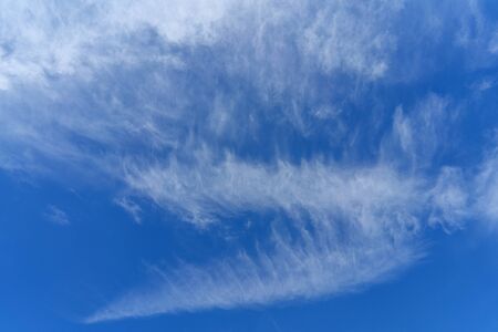 White clouds in the blue sky. Atmospheric phenomenon.の写真素材