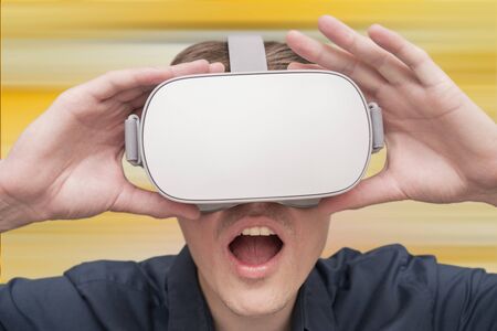 Young man of virtual reality. Innovation and technological advances. Modern technology for business.の写真素材