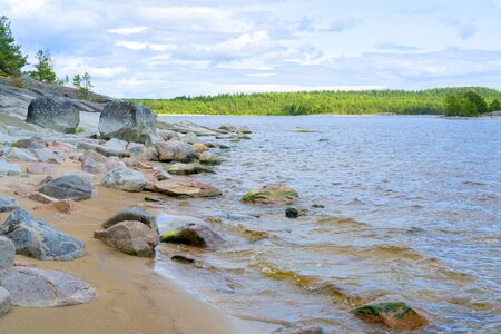 Islands in Lake Ladoga. Beautiful landscape - water, pines and boulders.の写真素材