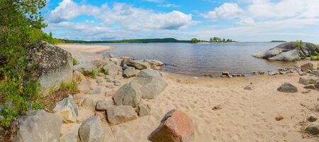 Islands in Lake Ladoga. Beautiful landscape - water, pines and boulders.の写真素材