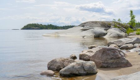 Islands in Lake Ladoga. Beautiful landscape - water, pines and boulders.の写真素材