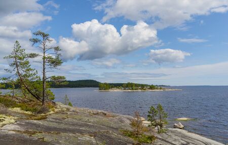 Islands in Lake Ladoga. Beautiful landscape - water, pines and boulders.の写真素材