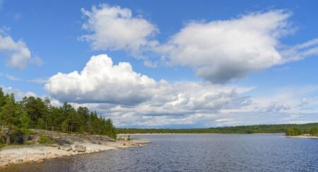 Islands in Lake Ladoga. Beautiful landscape - water, pines and boulders.の写真素材