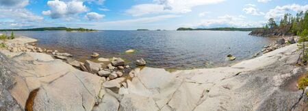 Islands in Lake Ladoga. Beautiful landscape - water, pines and boulders.の写真素材