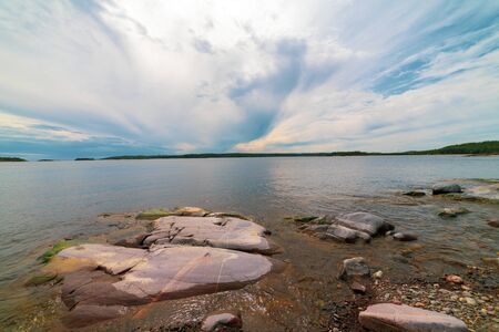 Islands in Lake Ladoga. Beautiful landscape - water, pines and boulders.の写真素材
