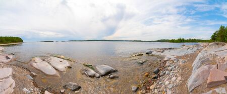Islands in Lake Ladoga. Beautiful landscape - water, pines and boulders.の写真素材