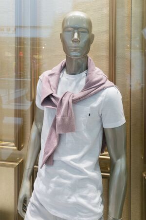 Mannequin in a shop window of men's clothing.の写真素材