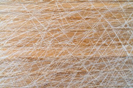Oak cutting board. Traces of knife scratches.の写真素材