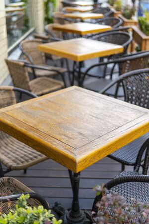 Wooden table in a street summer cafe.の写真素材