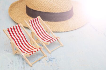 Travel set - deck chair, straw hatの写真素材