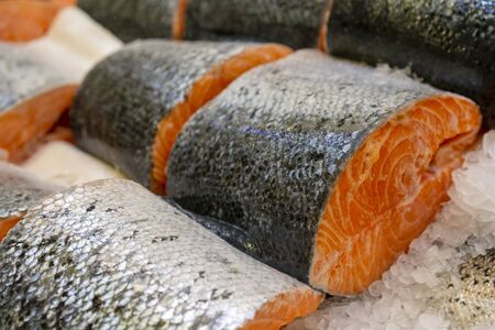 Salmon steak on counter ice in a supermarket.の写真素材