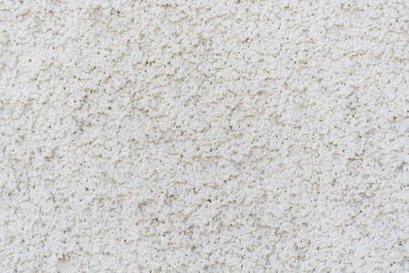 Gray texture of uneven plaster on the wall of the house.の写真素材