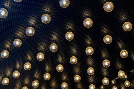 Round lights on the ceiling of the room.