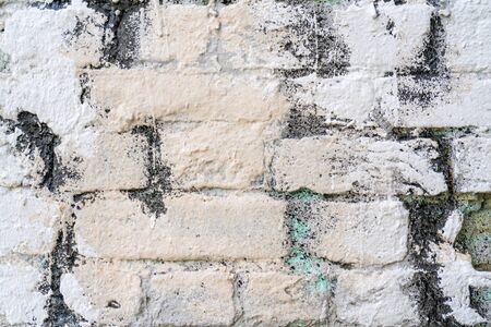White and beige paint on the wall of a house. Construction and repair.の写真素材