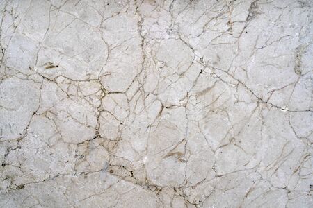 Cracks of gray marble. Wall of house. Construction industry.の写真素材