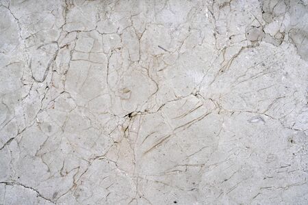Cracks of gray marble. Wall of house. Construction industry.の写真素材